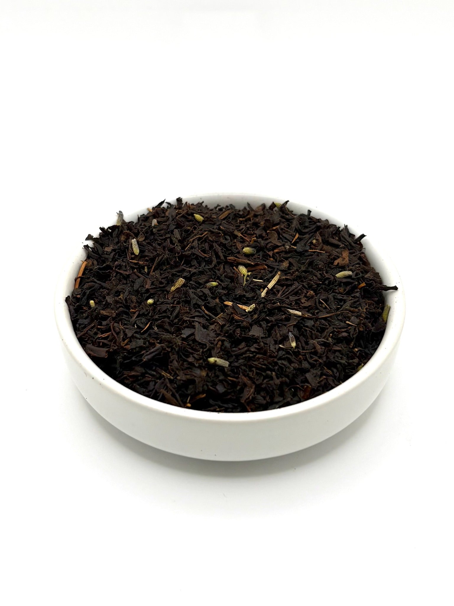 Loose leaf Earl Grey Lavender tea with aromatic lavender flowers in bowl
