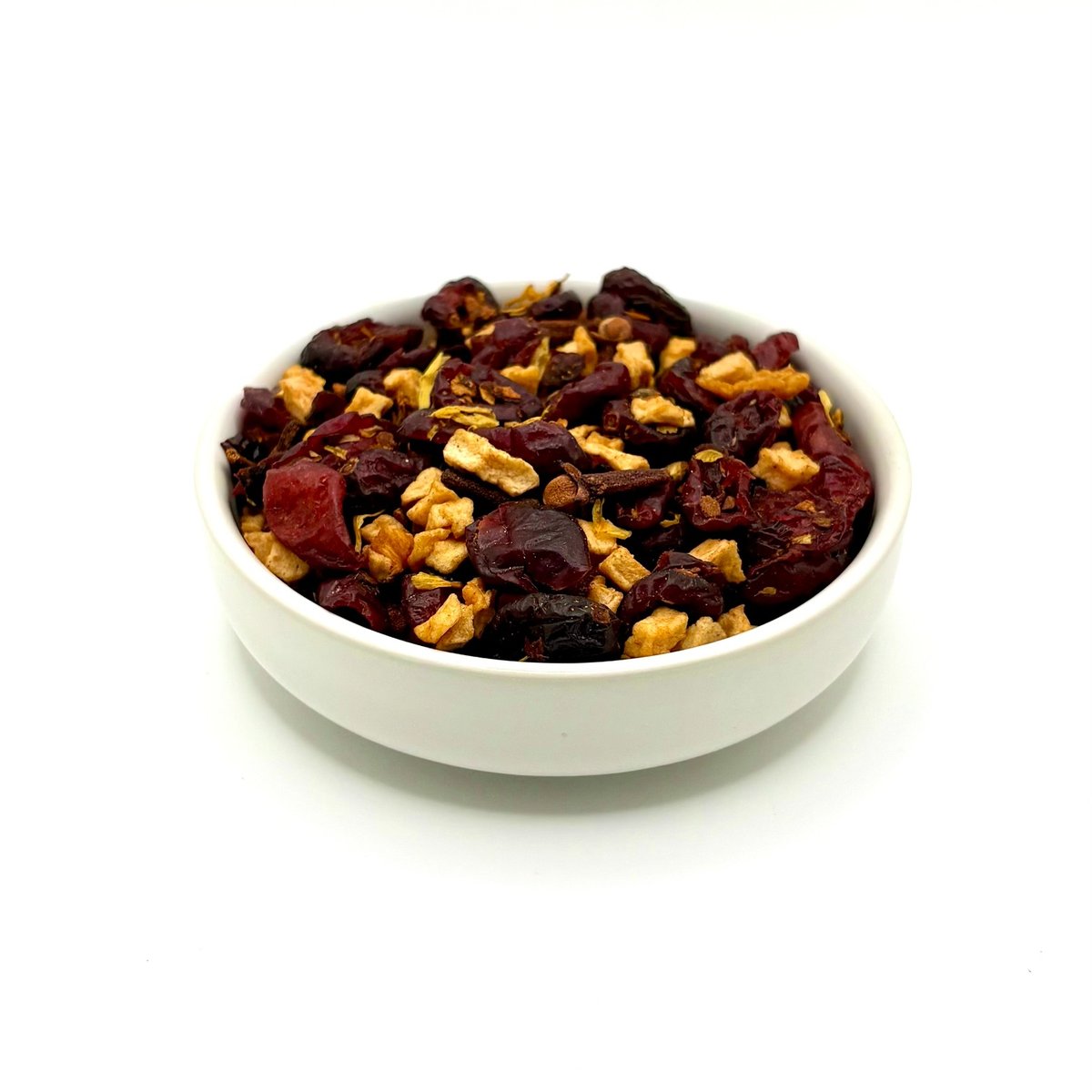 Organic Autumn Fruit and Flowers herbal tea blend close-up in white bowl
