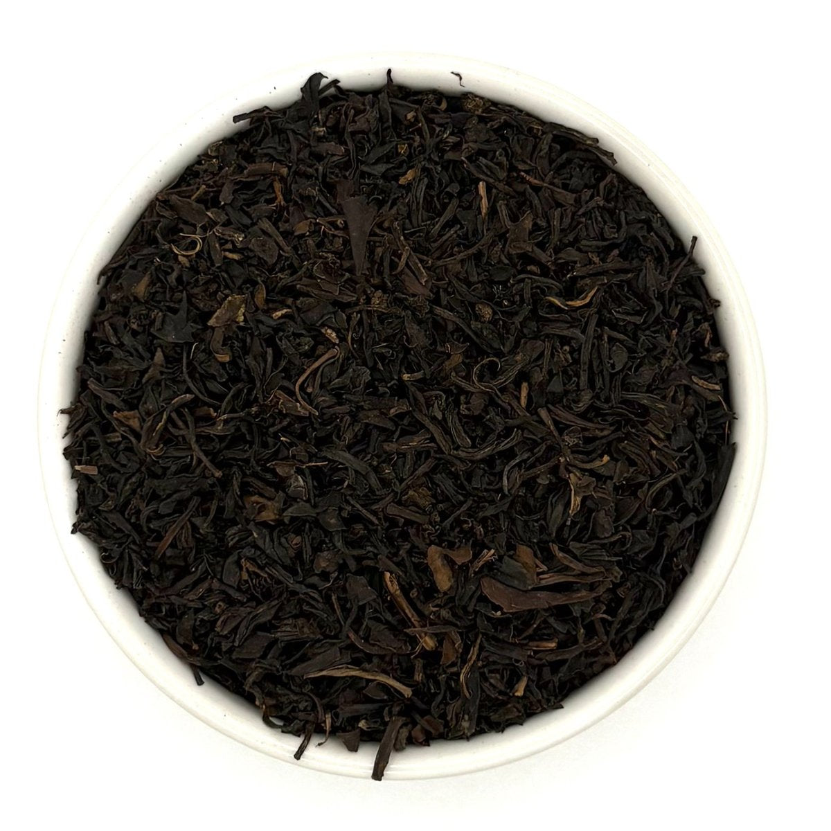 Top view of Organic Keemun Congou black tea leaves in bowl