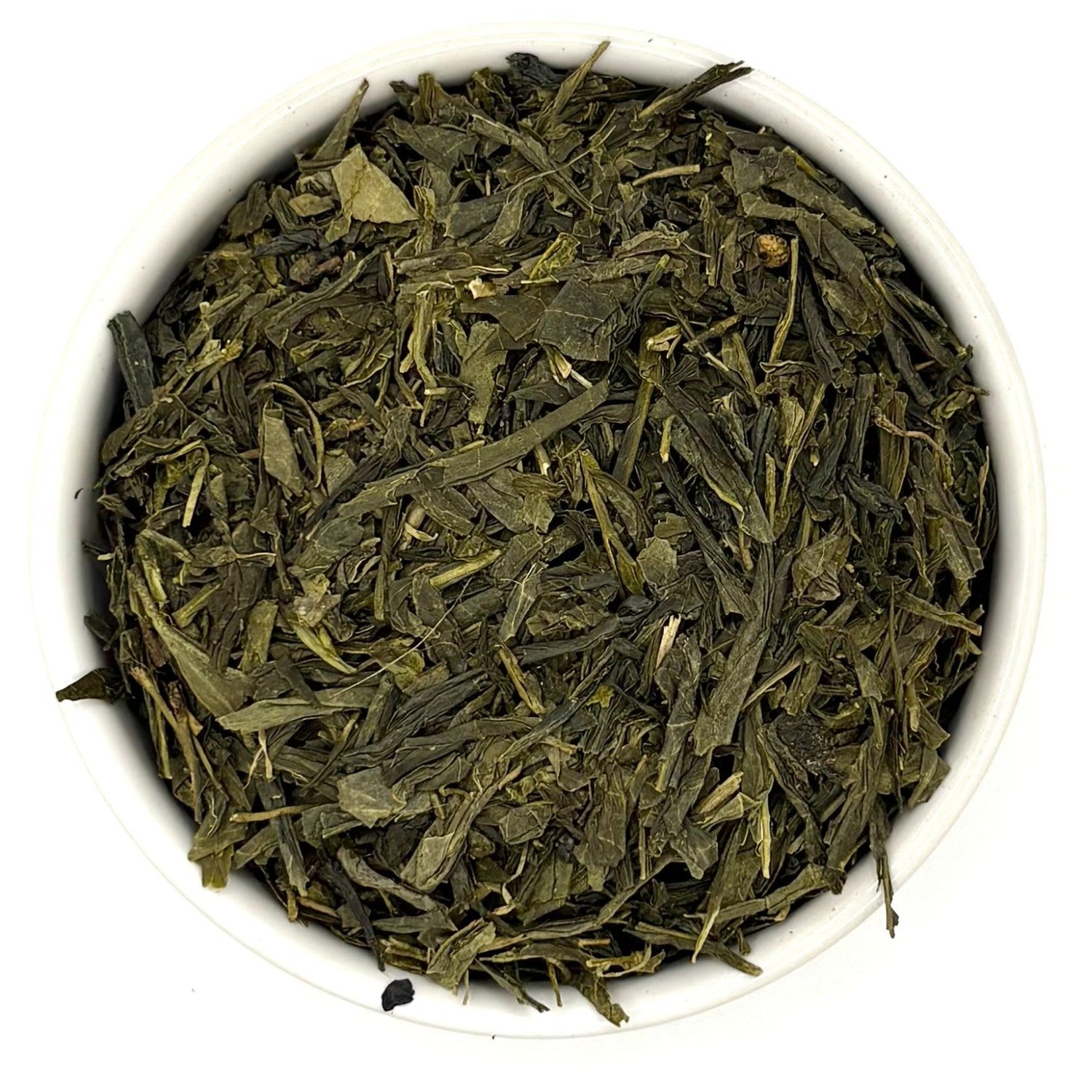 Top-down view of high-quality Sencha leaves, neatly layered in a white bowl against a white background