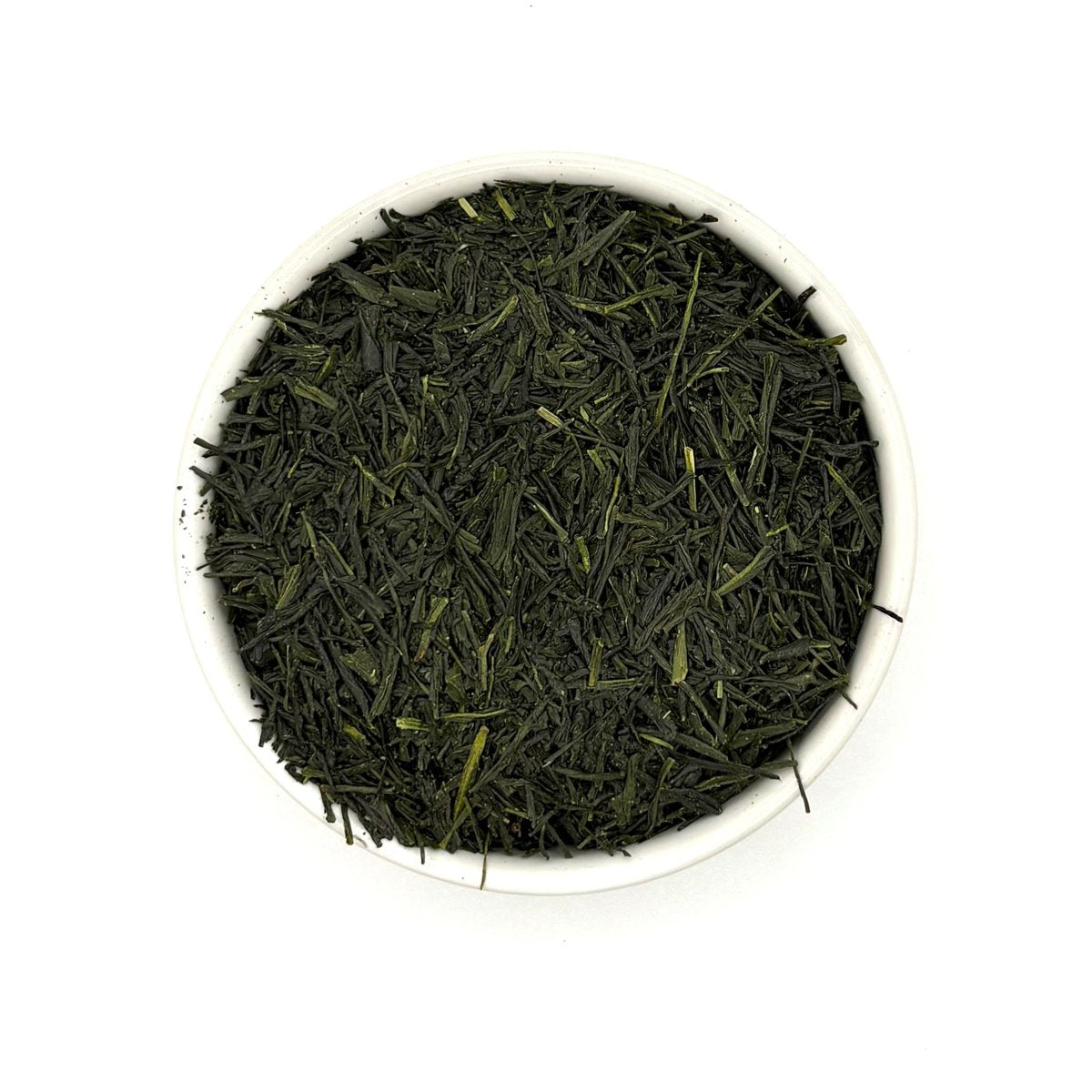 Top view of premium Gyokuro green tea leaves arranged neatly in a white bowl